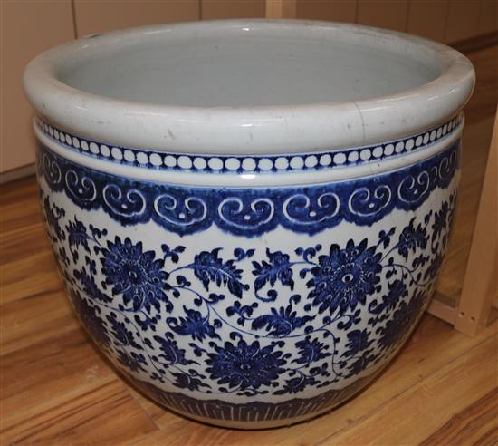 A large Chinese blue and white fish bowl, cracked, diameter 58cms